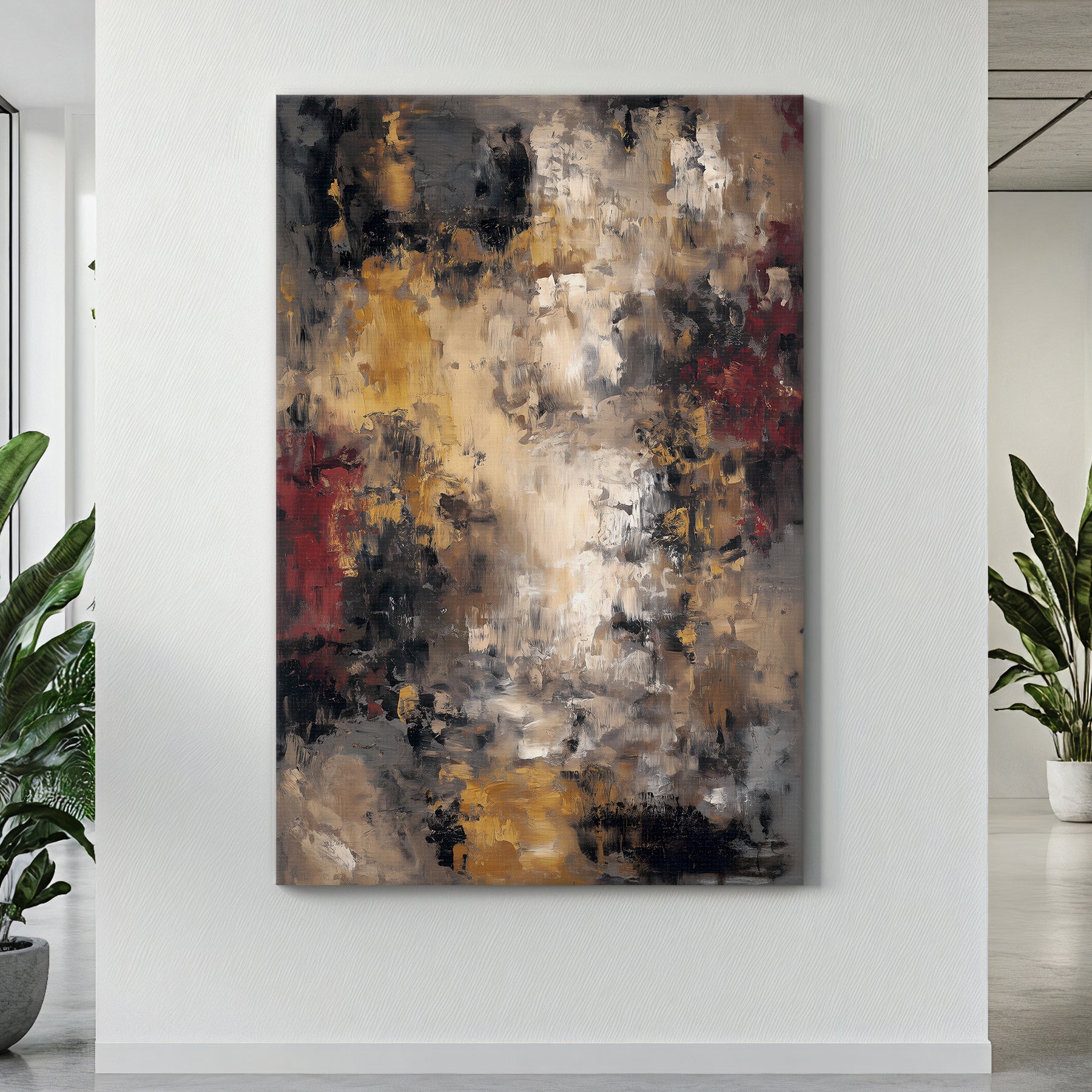 Abstract painting on a white wall with plants on either side