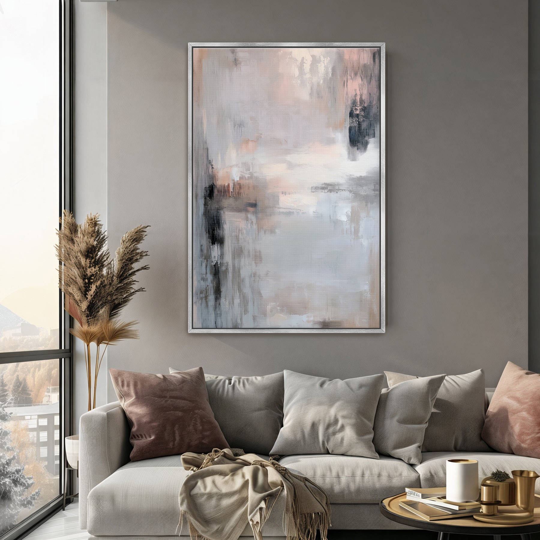 Living room with a gray sofa, abstract art on the wall, and decorative items.