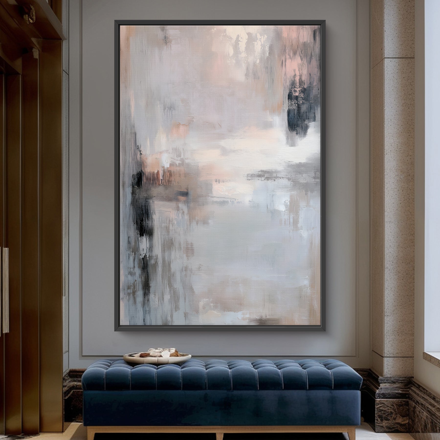 Abstract painting on a wall above a blue bench in a room with architectural details.