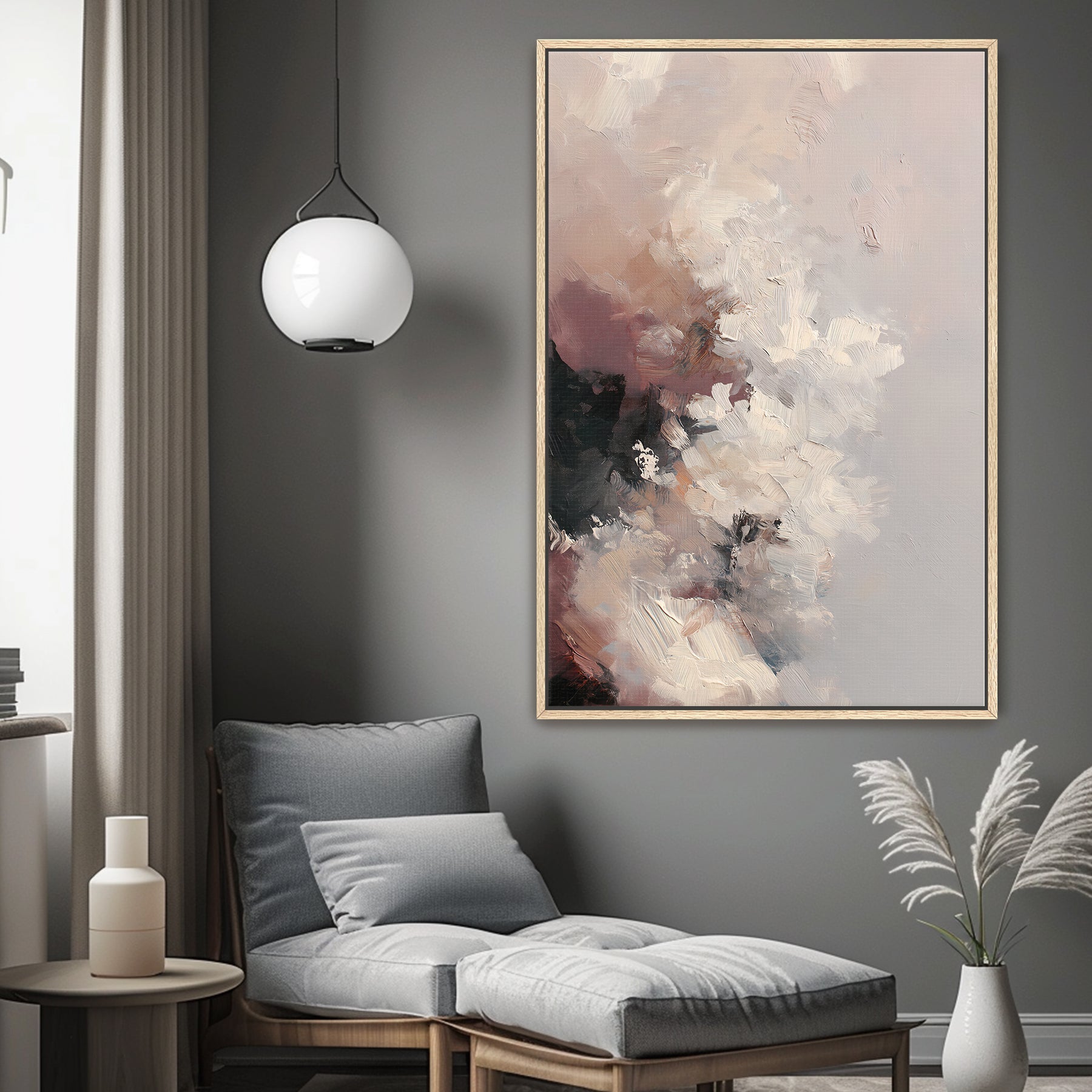 Modern living room with abstract art, gray chair, and decorative elements.