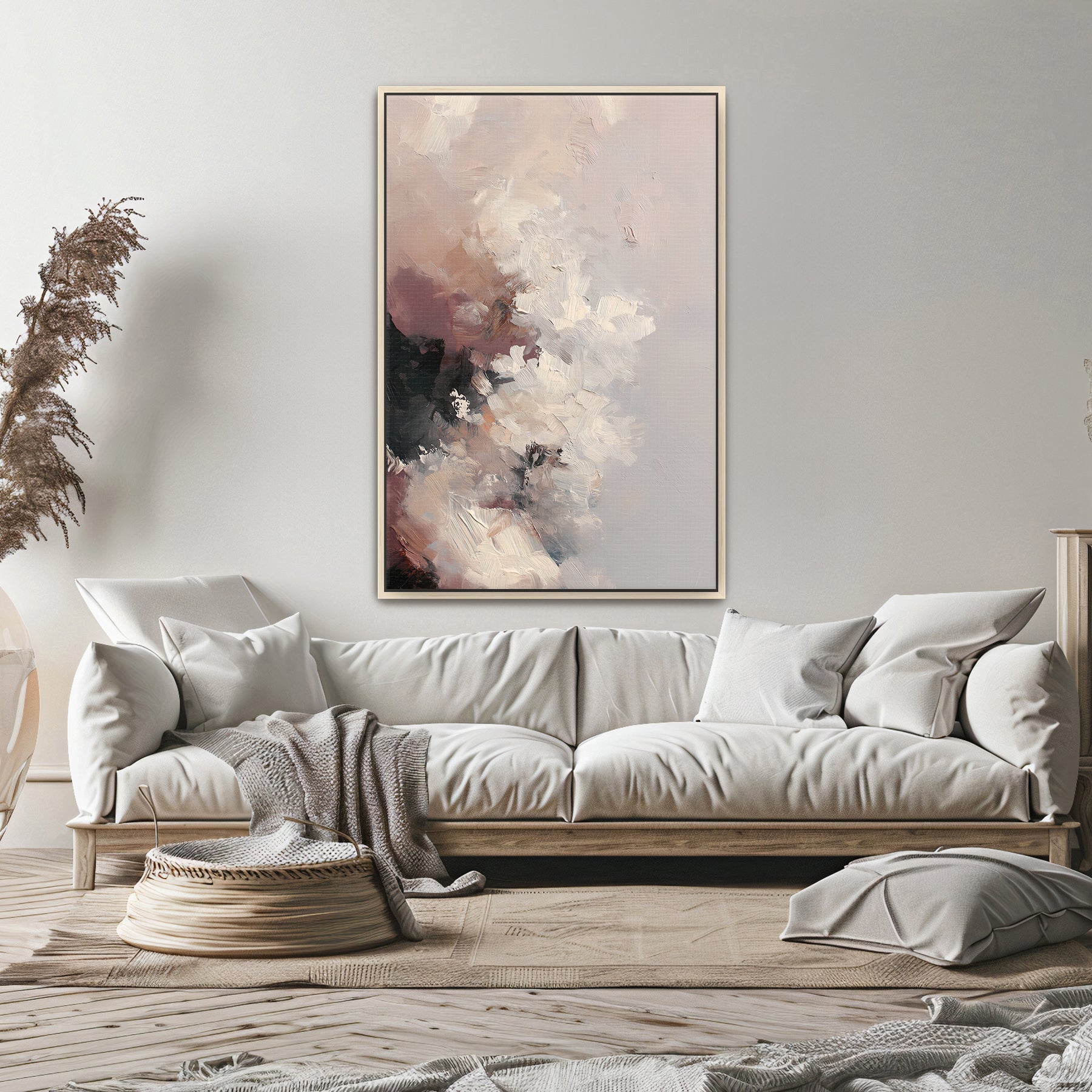 Living room with a beige sofa, abstract painting, and decorative items.