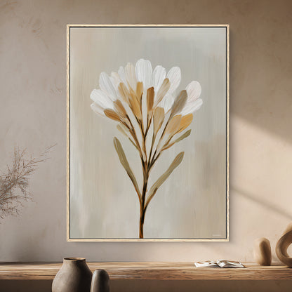 Framed minimalist floral canvas wall art in soft neutral tones. Designed to bring warmth and elegance to modern interiors.